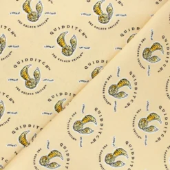 Tissu coton Harry Potter Quidditch et vif d'or - orange
